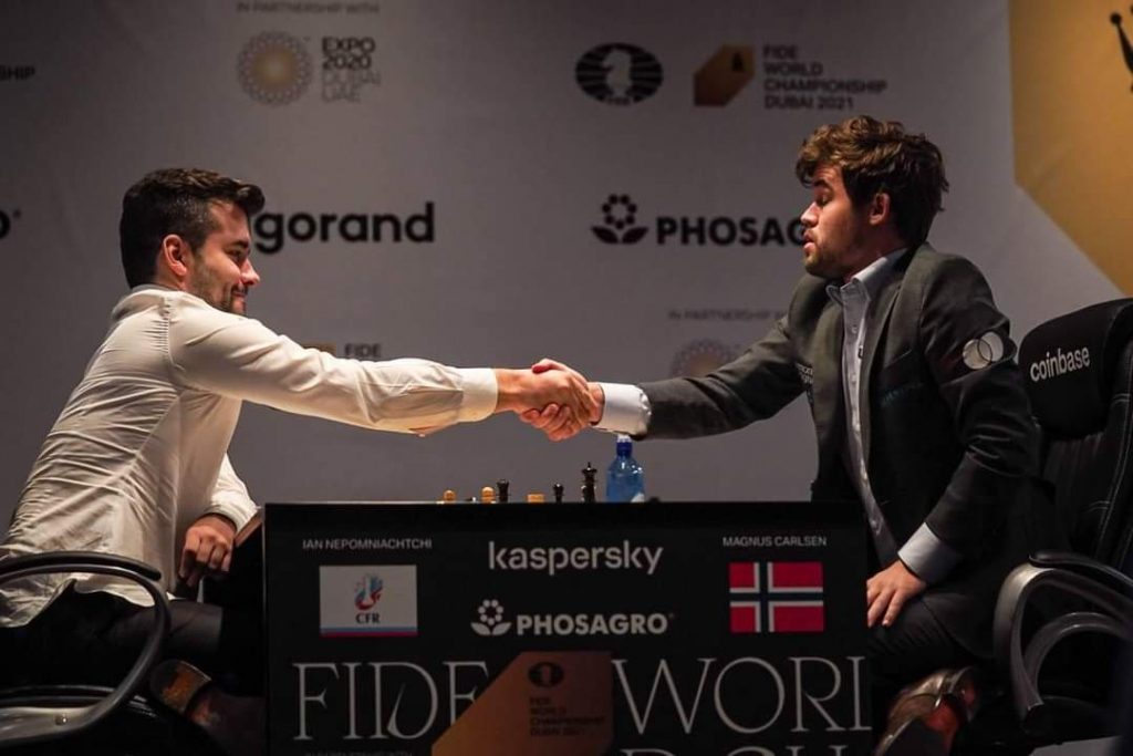 Magnus Carlsen and Ian Nepomniachtchi have the final handshake in the 2021 FIDE World Chess Championship