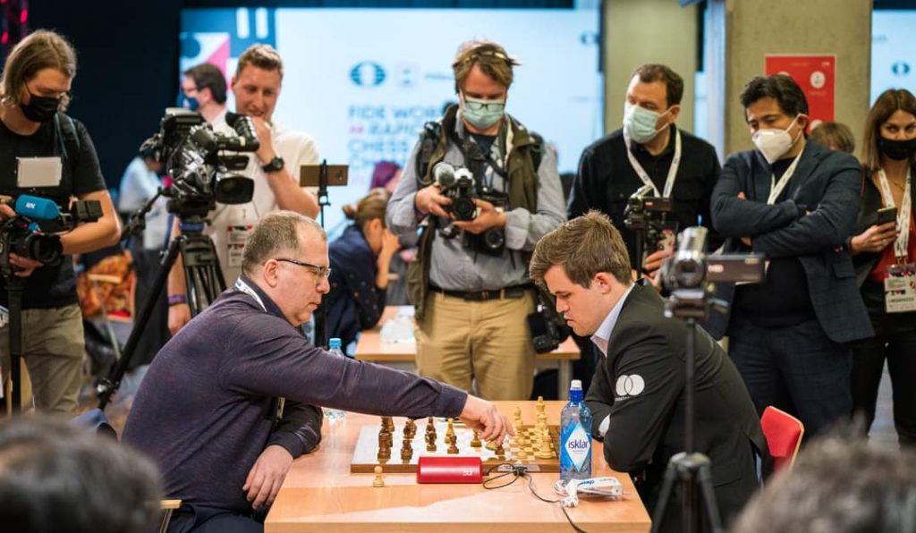 Magnus Carlsen Playing against an opponent in FIDE Rapid Championship 2021