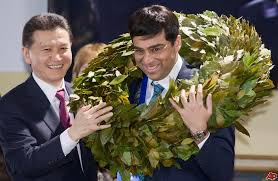 Vishwanathan Anand wearing a wreath of flowers as a newly crowned world champion