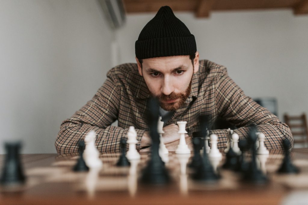 A man concentrating at a game of chess