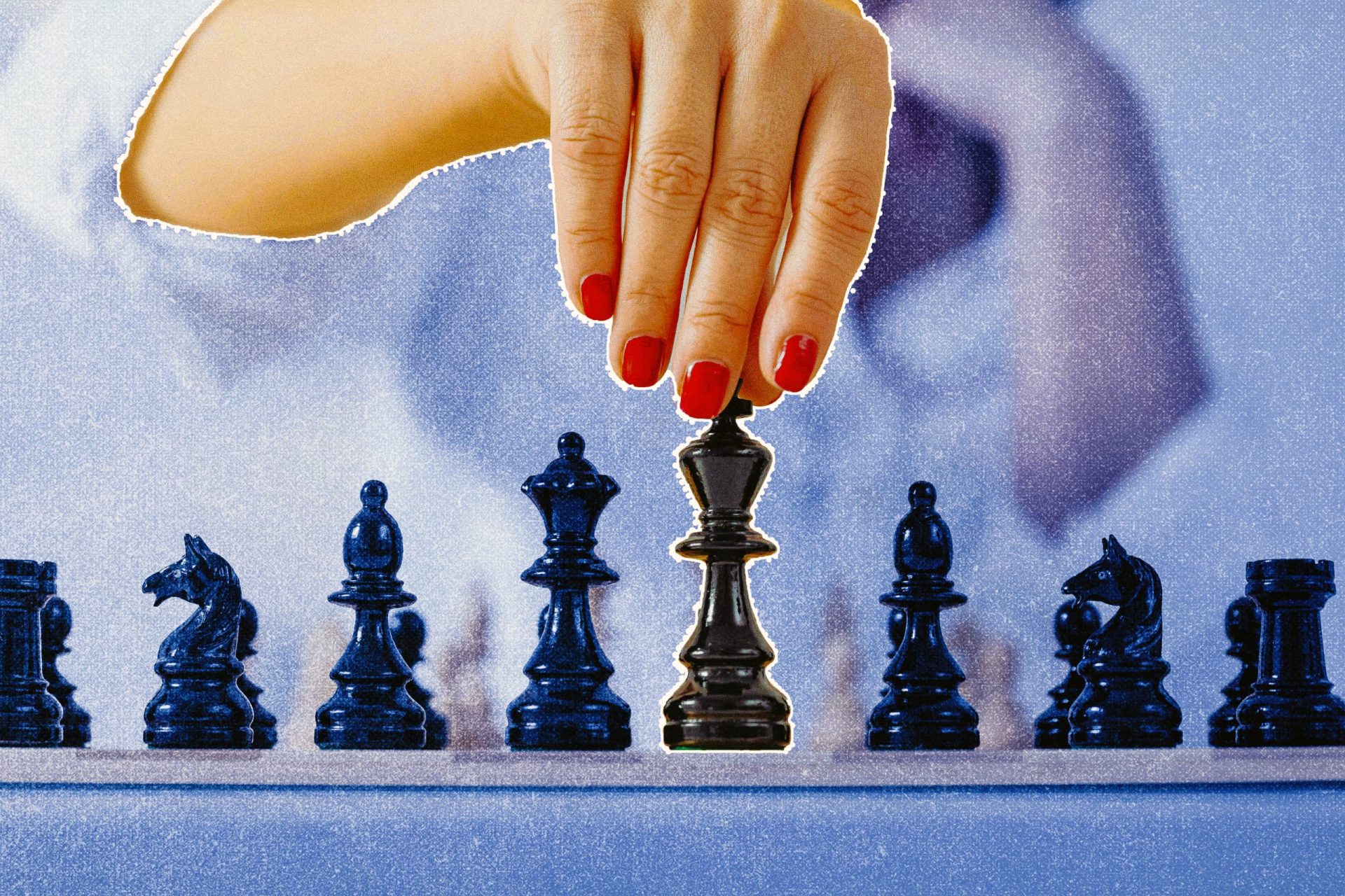 Woman hand moving a chess piece