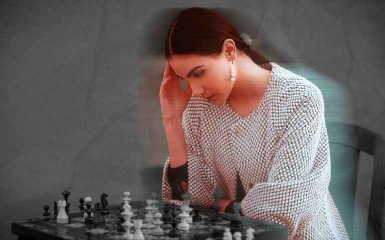 woman playing chess