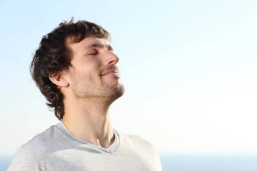 Handling Chess Losses: A Guide to Emotional Resilience 1 Man taking deep breath
