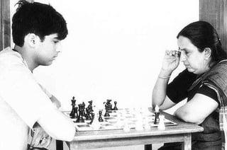 The Tiger of Madras: A Biography of Viswanathan Anand 1 An image in the biography of Viswanathan Anand showing a young Anand playing chess with his mother